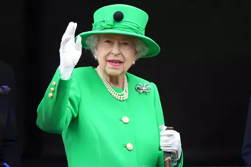 Britain's Queen Elizabeth II waves to the crowd during the Platinum Jubilee Pageant at the Buckingham Palace in London, June 5, 2022, on the last of four days of celebrations to mark the Platinum Jubilee. Queen Elizabeth II's death in September 2022 was arguably the most high-profile death this year. In her 70 years on the British throne, she helped modernize the monarchy across decades of enormous social change, royal marriages and births, and family scandals. For most Britons, she was the only