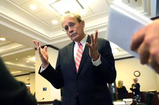 Mississippi Lt. Gov. Delbert Hosemann, a Republican, speaks with reporters, Wednesday, Dec. 6, 2023, after a meeting of the Joint Legislative Budget Committee in Jackson, Miss. Hosemann says the Republican-controlled Mississippi Legislature is watching economic trends as it considers how to set a state spending plan for the year that begins July 1, 2024. (AP Photo/Rogelio V. Solis)