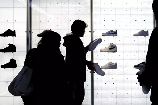People shop for shoes in a Nike store on , Nov. 25, 2022, in New York. “Buy now, pay later” services like Affirm, Afterpay and Klarna can sometimes provide a cheaper, more accessible version of credit. These services essentially provide customers an alternative way to pay for purchases over time without going into credit card debt or taking out a traditional personal loan. Travel purchases, such as airfare and vacation rentals, are the fastest-growing segment for buy now, pay later services.