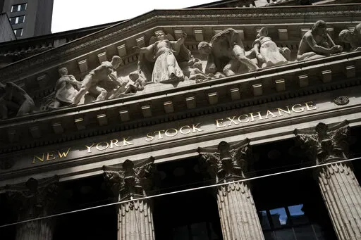 Statues adorn the facade of the New York Stock Exchange Thursday, July 14, 2022, in New York.  Stocks are opening higher on Wall Street, Friday, Sept. 2,  after a solid report on the jobs market last month that also didn't came in too high.(AP Photo/John Minchillo, File)