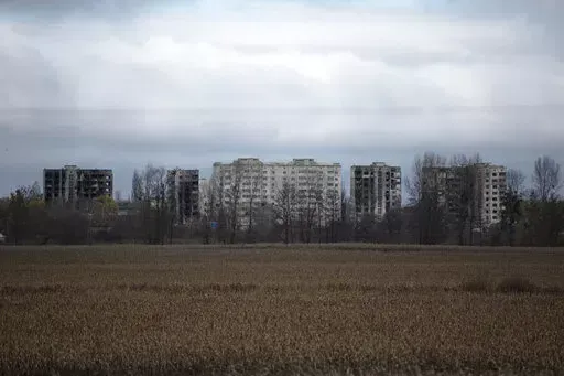 A view of apartment buildings destroyed by fighting, in Borodyanka, Kyiv region, Ukraine, Sunday, Nov. 13, 2022. Ukraine says it will investigate video footage circulated on Russian social media which Moscow alleged shows that Ukrainian forces killed Russian troops who may have been trying to surrender, after one of the men seemingly refused to lay down his weapon and opened fire. (AP Photo/Andrew Kravchenko, File)