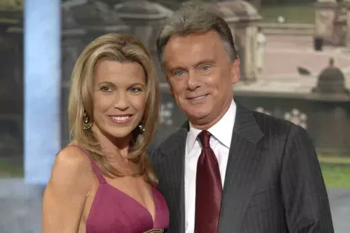 Vanna White, left, and Pat Sajak make an appearance at Radio City Music Hall for a taping of celebrity week on "Wheel of Fortune" in New York on Sept. 29, 2007. (AP Photo/Peter Kramer, file)