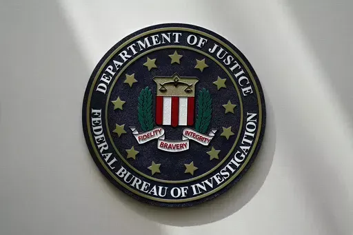 The FBI seal is pictured in Omaha, Neb., Aug. 10, 2022. FBI officials repeatedly violated their own standards when they searched a vast repository of foreign intelligence for information related to the insurrection at the U.S. Capitol on Jan. 6, 2021, and racial justice protests in 2020. That's according to a heavily blacked-out court order released Friday, May 19, 2023. FBI officials said the violations predated a series of corrective measures that started in the summer of 2021 and continued la
