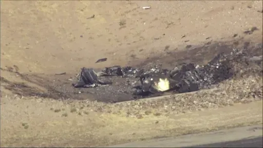 In this image taken from video, plane debris seen from above at Marana Regional Airport after a deadly crash in Marana, Ariz. on Wednesday, Feb 19, 2025. (KNXV via AP)