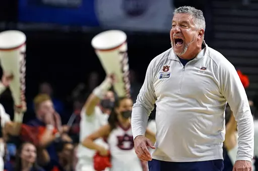 Auburn head coach Bruce Pearl yells towards his players during the first half of a college basketball game in the second round of the NCAA tournament against Miami, Sunday, March 20, 2022, in Greenville, S.C. (AP Photo/Brynn Anderson)