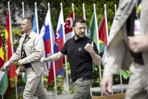 Ukrainian President Volodymyr Zelenskyy walks during the Summit on peace in Ukraine, in Obbürgen, Switzerland, Sunday, June 16, 2024. (Michael Buholzer/Keystone via AP)
