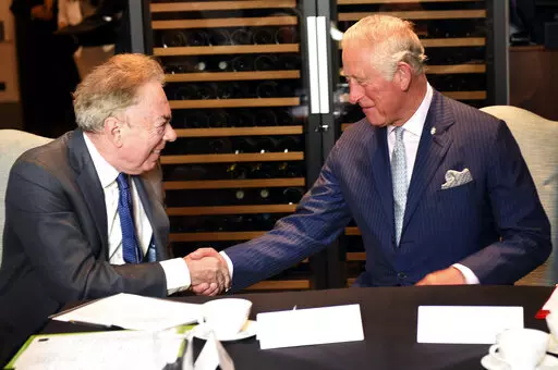 Britain's Prince Charles meets Andrew Lloyd Webber during a visit to the Royal Albert Hall to discuss the arts and creativity in school, in London, Wednesday, Sept. 5, 2018. Andrew Lloyd Webber, the English composer who created the scores for blockbuster musicals such as “Cats,’’ “The Phantom of the Opera’’ and “Evita,’’ has written the anthem for King Charles III’s coronation, adapting a piece of church music that encourages singers to make a “joyful noise.” (Eddie Mulho