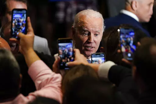 President Joe Biden greets people after speaking during a Democratic National Committee event at the National Education Association Headquarters, Sept. 23, 2022, in Washington. Biden is picking up the pace of his high-dollar fundraisers for party candidates and committees in the last stretch ahead of the midterms. The receptions have been one of the most visible ways Biden has been deployed this political season at a time when his approval ratings remain underwater and many Democrats aren’t ea