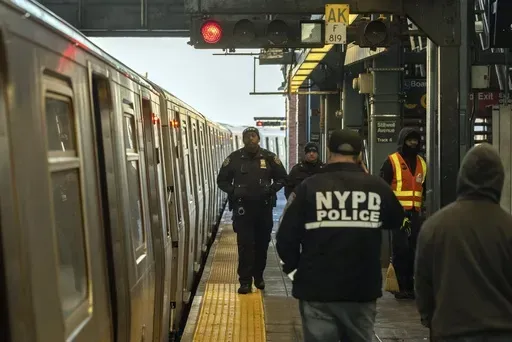 Police officers patrol the F train platform at the Coney Island-Stillwell Avenue Station, Thursday, Dec. 26, 2024, in New York. (AP Photo/Yuki Iwamura, File)