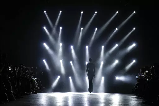 A model wears a creation as part of the Roberto Cavalli Fall/Winter 2022-2023 fashion collection, unveiled during the Fashion Week in Milan, Italy, Wednesday, Feb. 23, 2022. (AP Photo/Antonio Calanni)