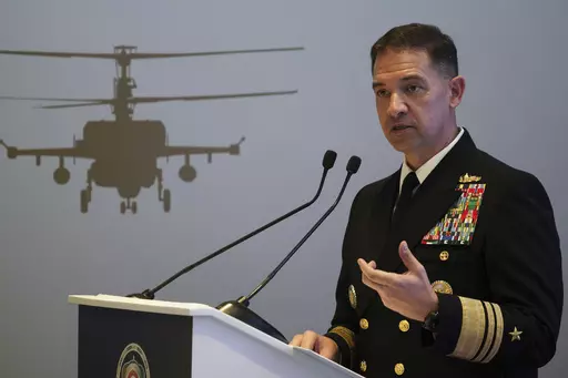 U.S. Navy Vice Adm. Brad Cooper, who heads the Navy's Bahrain-based 5th Fleet, speaks at an event at the International Defense Exhibition and Conference in Abu Dhabi, United Arab Emirates, Feb. 21, 2023. The top commander of U.S. naval forces in the Middle East says Yemen’s Houthi rebels are showing no signs of ending their “reckless” attacks on commercial ships in the Red Sea. But Vice Adm. Brad Cooper said in an Associated Press interview on Saturday that more nations are joining the int