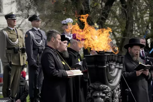 A rabbi prays during a 'Warsaw Ghetto Uprising' commemoration reception in Warsaw, Poland, Wednesday, April 19, 2023. Presidents, Holocaust survivors and their descendants are marking the 80th anniversary of the Warsaw Ghetto Uprising. The anniversary honors the hundreds of young Jews who took up arms in Warsaw in 1943 against the overwhelming might of the Nazi German army. (AP Photo/Czarek Sokolowski)