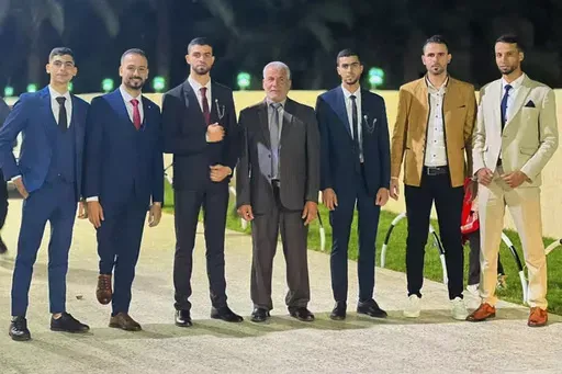 In this photo provided by the family, Mohanad Al-Agha, second from left, stands with his brothers and father, Amin al-Agha, center, on Oct. 5, 2023 during the wedding of Hamid al-Agha, third from left. Days later, everyone in the photo, except the groom and Mohamed al-Agha, second from right, were killed in an airstrike on the family home in western Khan Younis on Oct. 11, 2023. (Courtesy al-Agha family via AP)