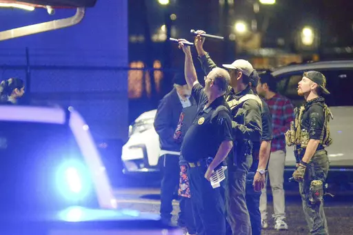 Police investigate the scene of a shooting that wounded several people Saturday, Dec. 2, 2023, in McComb, Miss. (Matt Williamson/The Enterprise-Journal via AP)