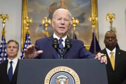 President Joe Biden speaks about Ukraine from the Roosevelt Room at the White House in Washington, Wednesday, Jan. 25, 2023, as Secretary of State Antony Blinken, left, and Defense Secretary Lloyd Austin listen. (AP Photo/Susan Walsh)