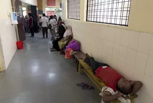 People wait to consult doctors at Tej Bahadur Sapru Hospital in Prayagraj, Uttar Pradesh state, India, Thursday, June 23, 2022. At least 34 people have died in the past two days as a large swath of the north Indian state of Uttar Pradesh swelters under severe heat, officials said Saturday, prompting doctors to advise citizens above 60 years of age against venturing out during the daytime. (AP Photo/Rajesh Kumar Singh, File)