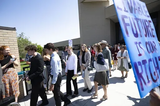Youth plaintiffs in the Held v. Montana climate case leave the Montana Supreme Court, on July 10, 2024, in Helena, Mont. (Thom Bridge/Independent Record via AP, File)