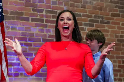 Republican U.S. Senate candidate Katie Britt reacts as she walks to the stage to talk to supporters during her watch party, Tuesday, May 24, 2022, in Montgomery, Ala. (AP Photo/Butch Dill)