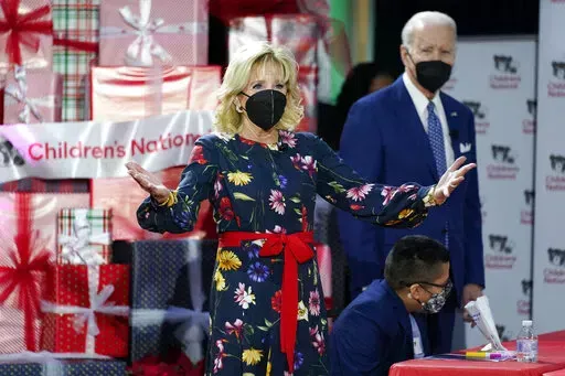 President Joe Biden and first lady Jill Biden greet patients at Children's National Hospital in Washington, Friday, Dec. 24, 2021. (AP Photo/Carolyn Kaster)