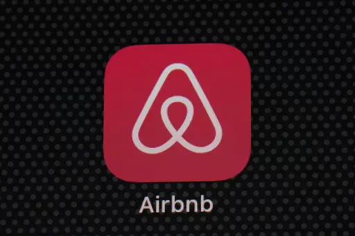 The Airbnb app icon is displayed on an iPad screen in Washington, D.C., on May 8, 2021. Airbnb says it's cracking down on fake listings, which are emerging as a major problem for customers of the short-term rental site. Airbnb said Wednesday Sept. 20 2023 it has removed 59,000 fake listings and blocked another 157,000 from joining the site this year. Fake listings and high cleaning fees are among several issues that customers are raising with Airbnb. (AP Photo/Patrick Semansky, File)