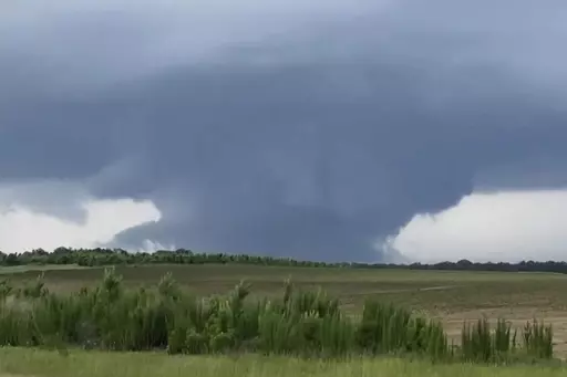 This screenshot taken from a video shows a tornado on June 14, 2023, in Blakely, Ga. Officials from Texas to Georgia are reporting damaging winds and possible tornadoes as a powerful storm system crosses the South. (Rand McDonald via AP)
