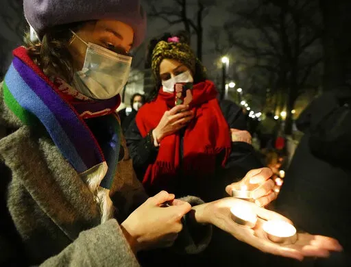 A group of women's rights activists protest against Poland's strict anti-abortion law, outside the top constitutional court, in Warsaw, Poland, Jan. 26, 2022. The government of Poland, where a near-total abortion ban is in place, faced accusations Monday, June 6, 2022, of creating a “pregnancy register” as the country expands the amount of medical data being digitally saved on patients. (AP Photo/Czarek Sokolowski, File)