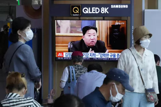 People watch a TV showing an image of North Korea leader Kim Jong Un during a news program at the Seoul Railway Station in Seoul, South Korea, Monday, June 13, 2022. Kim and his top deputies have pushed for a crackdown on officials who abuse their power and commit other "unsound and non-revolutionary acts," state media reported Monday, as Kim seeks greater internal unity to overcome a COVID-19 outbreak and economic difficulties. (AP Photo/Ahn Young-joon)