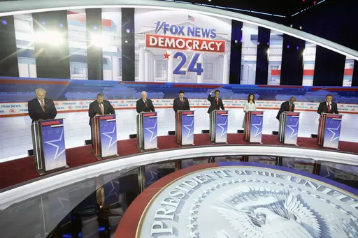 Republican presidential candidates, from left, former Arkansas Gov. Asa Hutchinson, former New Jersey Gov. Chris Christie, former Vice President Mike Pence, Florida Gov. Ron DeSantis, businessman Vivek Ramaswamy, former U.N. Ambassador Nikki Haley, Sen. Tim Scott, R-S.C., and North Dakota Gov. Doug Burgum stand on stage before a Republican presidential primary debate hosted by FOX News Channel Wednesday, Aug. 23, 2023, in Milwaukee. (AP Photo/Morry Gash, File)