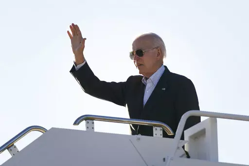 President Joe Biden waves before boarding Air Force One at El Paso International Airport in El Paso, Texas, Sunday, Jan. 8, 2023, to travel to Mexico City, Mexico. The Justice Department is reviewing a batch of potentially classified documents found in the Washington office space of President Joe Biden's former institute, the White House said Monday, Jan. 9. (AP Photo/Andrew Harnik)