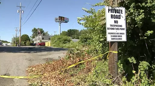 Crime tape is placed near the scene of a overnight shooting in Methuen, Mass., early Sunday, June 16, 2024. Authorities say seven people were shot and wounded and an eighth was hurt while running away when gunfire erupted at a large gathering of young people. (WCVB via AP)