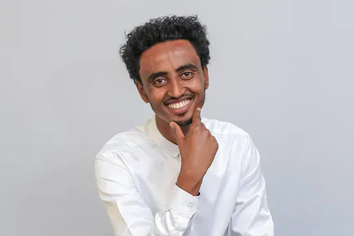 Freelance video journalist Amir Aman Kiyaro, who is accredited to The Associated Press and has been in detention since November 2021 without charges, poses for a photograph in Ethiopia on Oct. 17, 2021. An Ethiopian court on Tuesday, March 29, 2022 ordered journalist Amir Aman Kiyaro to be released on bail, after being imprisoned for four months without charges, while prosecutors determine whether or not to press charges against him. (AP Photo, File)