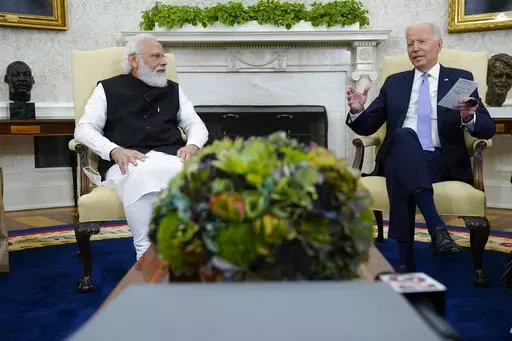 President Joe Biden meets with Indian Prime Minister Narendra Modi in the Oval Office of the White House, Sept. 24, 2021, in Washington. President Biden is set to speak with Indian Prime Minister Modi, Monday, April 11, 2022 when the two will virtually discuss the Ukraine war and other matters. India has earned Russian praise by maintaining a neutral stance in the war. India abstained when the U.N. General Assembly voted Thursday to suspend Russia from its seat on the 47-member Human Rights Coun