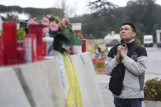 Hoang Phuc Nguyen, a Vietnamese pilgrim, prays for Pope Francis at the Agostino Gemelli Polyclinic, in Rome, Tuesday, Feb. 25, 2025 where Pope Francis is hospitalised since Friday, Feb. 14. (AP Photo/Alessandra Tarantino)