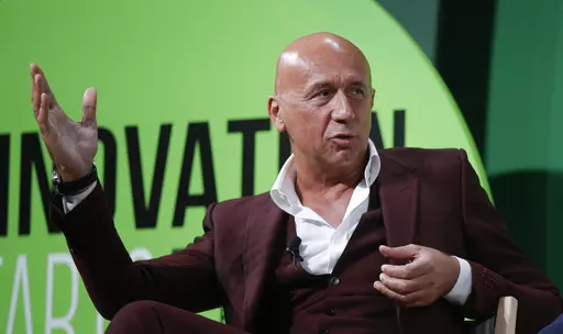 Gucci President Marco Bizzarri, gestures as he attends a conference titled 'The Innovation Summit', in Milan, Italy, on July 3, 2017. Bizzarri is stepping down later this year, the latest shakeup to the luxury fashion brand and coming as part of a series of changes to the French conglomerate Kering that owns it. (AP Photo/Luca Bruno, File)