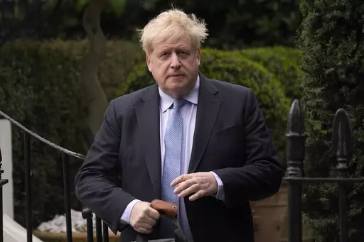 Boris Johnson leaves his house in London, on March 22, 2023. Former Prime Minister Boris Johnson deliberately misled Parliament about the lockdown-flouting parties that undermined his credibility and contributed to his downfall, a committee of lawmakers said Thursday, June 15, 2023 after a year-long investigation. (AP Photo/Alberto Pezzali, File)