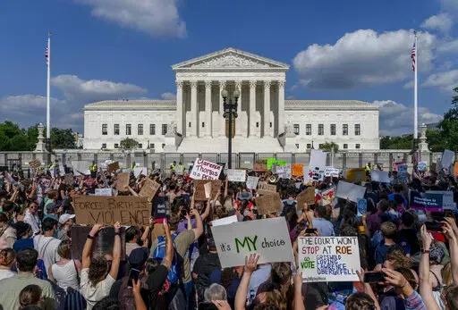 Abortion-rights and anti-abortion demonstrators gather outside of the Supreme Court in Washington, Friday, June 24, 2022. The Supreme Court has ended constitutional protections for abortion that had been in place nearly 50 years, a decision by its conservative majority to overturn the court's landmark abortion cases. (AP Photo/Gemunu Amarasinghe)