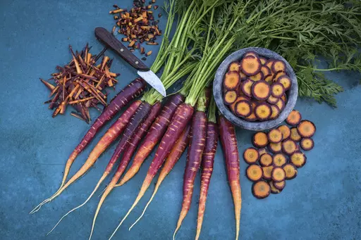 This image provided by Baker Creek Heirloom Seed Co. shows Lila Lu Sang carrots, which are deep purple on the outside and bright orange on the inside. (Baker Creek Heirloom Seed Co./rareseeds.com via AP)