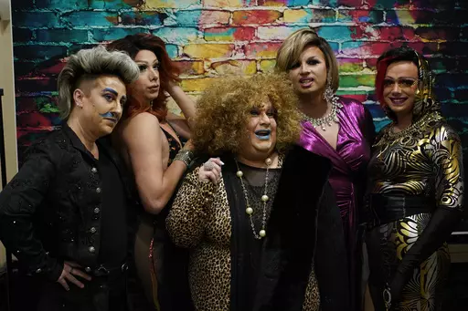 Members of the Daniels drag family pose for a photograph during their "Daniels Family Values" drag show at the Heritage Restaurant in Shamokin, Pa., Saturday, April 16, 2022. They are, from left, Xander Valentine, aka Gwen Bobbie; Harpy Daniels, aka Joshua Kelley; Alexus Daniels, Tequila Daniels, aka Tony Nahodil, and Trixy Valentine, aka Jacob Kelley. Lawmakers in many red states are pushing to restrict drag, yet deep in Pennsylvania coal country, performers in the Daniels drag family are firml