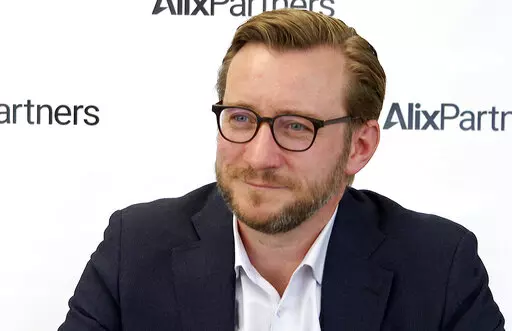 In this Monday, March 21, 2022, image made from video, Mark Wakefield, co-leader of AlixPartners’ global automotive unit, speaks during an interview with The Associated Press at the consulting firm’s offices in Southfield, Mich. Russia’s war on Ukraine is bringing new problems to the global auto industry. As Wakefield said: “You only need to miss one part to not be able to make a car.” (AP Photo/Mike Householder)