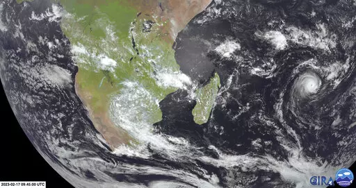 This image from Meteosat-9 satellite shows Cyclone Freddy, right, in the Indian Ocean near Madagascar, Friday, Feb. 17, 2023. Two weeks after Tropical Cyclone Cheneso devastated Madagascar, the Indian Ocean island nation and its neighbors are bracing for a more powerful Cyclone Freddy. (NOAA via AP)