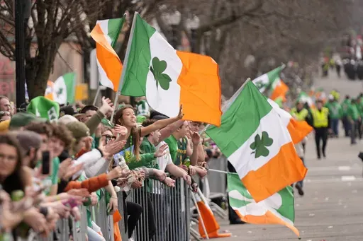 Spectators celebrate during the St. Patrick's Day parade, Sunday, March 16, 2025, in Boston, Mass. (AP Photo/Robert F. Bukaty)
