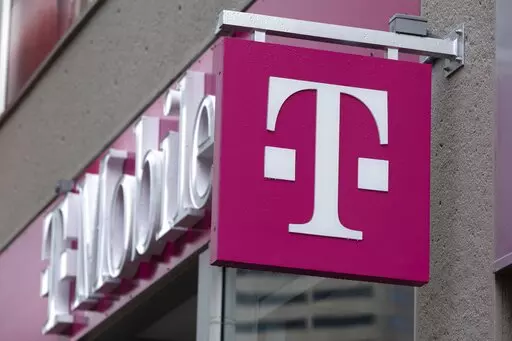 The T-Mobile logo is seen on a storefront, Oct. 14, 2022, in Boston. The U.S. wireless carrier T-Mobile said Thursday, Jan. 19, 2023, that an unidentified malicious intruder breached its network in late November and stole data on 37 million customers, including addresses, phone numbers and dates of birth. (AP Photo/Michael Dwyer, File)