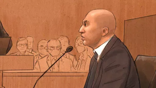 In this courtroom sketch, former Minneapolis Police Officer J. Alexander Kueng testifies during his trial in the killing of George Floyd in federal court in St. Paul, Minn., on Wednesday, Feb. 16, 2022. Kueng is one of three former officers charged in federal court with violating Floyd's constitutional rights when Officer Derek Chauvin pressed his knee into Floyd's neck for 9 1/2 minutes as the 46-year-old man was handcuffed, facedown on the street. (Cedric Hohnstadt via AP)
