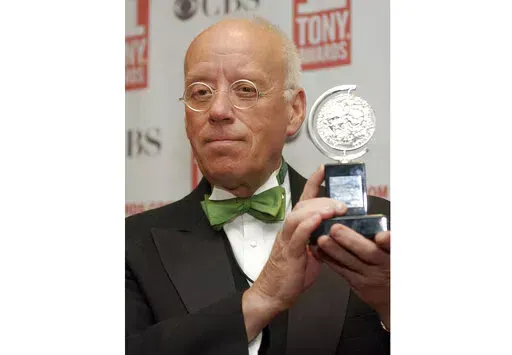 Eugene Lee poses with his Tony Award for Best Scenic Design for "Wicked" at the Tony Awards in New York on June 6, 2004. Lee, the six-time Emmy Award-winning production designer for “Saturday Night Live” and who won three Tony Awards for his Broadway sets, died Tuesday in Providence, R.I. He was 83. (AP Photo/Richard Drew, File)