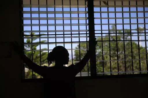 A woman who did not want to give her name for fear of retaliation poses for a photo during an interview at a clinic near Port-au-Prince, Haiti, Friday, Jan. 20, 2023. The 36-year-old sent her two children to live with family in another part of the city after her husband was kidnapped and killed. Later, the men gang-raped her and forced her to flee her home. (AP Photo/Odelyn Joseph)