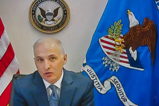 Assistant Attorney General for National Security Division Matthew Olsen, seen from a video monitor, testifies remotely before a Senate Judiciary Committee during a virtual hearing to examine the domestic terrorism threat one year after January 6, on Capitol Hill, Thursday, Feb. 10, 2022, in Washington. (AP Photo/Manuel Balce Ceneta)