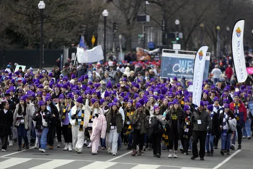 People participating in the annual March for Life, walk from the Washington Monument to the Supreme Court, Friday, Jan. 24, 2025, in Washington.(AP Photo/Ben Curtis)