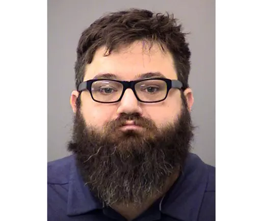 This booking photo provided by the Indianapolis Metropolitan Police Department shows Dustin Passarelli, who was charged in the road rage shooting death of a Muslim man. The Indiana man has been convicted of murder Wednesday, May 17, 2023, in the road rage shooting death of a Muslim man who witnesses said he made ethnic and religious insults against, including yelling “go back to your country,” before the shooting. (Indianapolis Metropolitan Police Department via AP, File)