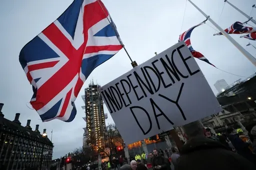 Brexit supporters gather during a rally in London, Friday, Jan. 31, 2020. Britain officially leaves the European Union on Friday after a debilitating political period that has bitterly divided the nation since the 2016 Brexit referendum. (AP Photo/Frank Augstein, File)