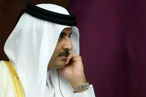 The Emir of Qatar, Sheikh Tamim bin Hamad Al Thani reacts during a meeting, in Astana, Kazakhstan, Thursday, Oct. 13, 2022. Sheikh Tamim bin Hamad Al Thani, channeled the wider anger in the Arab world over Israel's unrelenting airstrikes and siege of the Gaza Strip that the Hamas-controlled Health Ministry says has killed over 5,000 people so far. (Vyacheslav Prokofyev, Sputnik, Kremlin Pool Photo via AP, File)